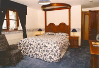Tyddyn Mawr Guesthouse's luxurious blue bedroom upstairs with balcony